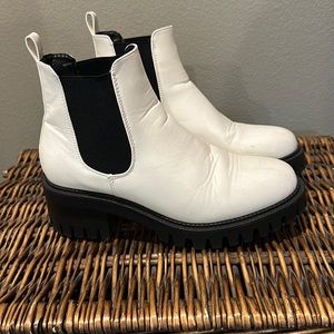 White patent leather boots. In good condition. No brand, boutique bought.